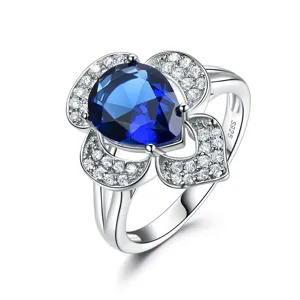 Elegant 925 sterling silver flower ring featuring a stunning pear-shaped blue sapphire crystal.