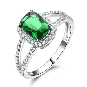 Eleganter 925 Silber Ring mit grünem Zirkonia Stein und funkelndem Halo Design.