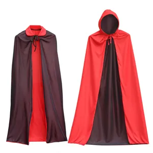 Detailed view of reversible black and red Halloween capes, featuring hooded and collared designs.