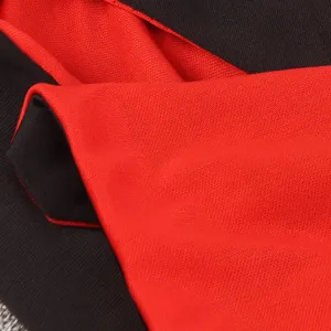 Halloween black and red cloak fabric detail, premium dual-color costume material for party.