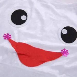 Velvet fabric close-up with cute cartoon eyes and red smile mouth applique for Christmas costume.