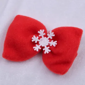 Red felt Christmas bow with white snowflake ornament, perfect for holiday decor and festive attire.