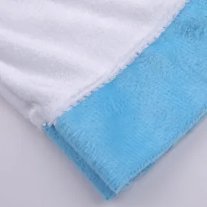 Close-up detail of soft plush velvet fabric with white and blue color block design texture.