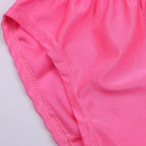 Pink swimsuit fabric close-up, elastic smooth material with neat stitching for kids.