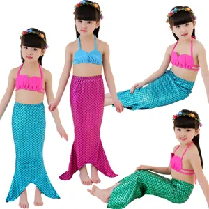 Details of children mermaid swimsuit set, sparkling scale tail and shell bikini top.