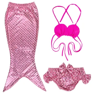 Kids pink mermaid swimsuit detail shot, cute seashell bikini top and sparkling tail skirt.