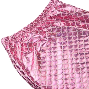 Kids mermaid swimsuit detail, pink metallic fish scale pattern, elastic waistband fabric.