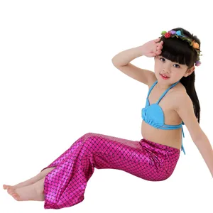 Detailed view of the sparkling pink mermaid tail fin and blue seashell bikini top for kids.