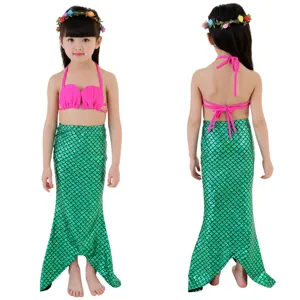 Children mermaid swimsuit set for girls, pink shell bikini top and green scale fish tail.