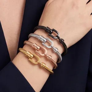 Fashion 18k gold PVD titanium steel cable cuff bracelet set with horseshoe U-shaped clasp.