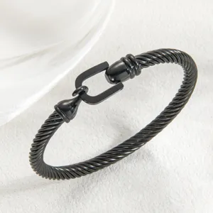 Black titanium steel cable bracelet with unique U-shaped horseshoe clasp, fashion jewelry.