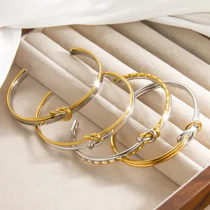Modischer Titanstahl geknoteter offener Armreif 18k vergoldet minimalistisches Armband