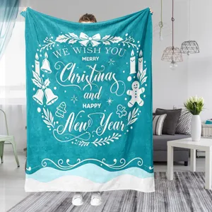 Christmas flannel blanket detail view with festive white wreath print in cozy indoor home setting