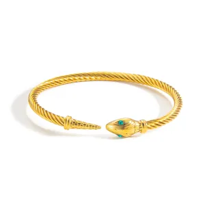 Bracelet jonc tete de serpent en cable dore avec yeux cristaux vert pour femme mode.