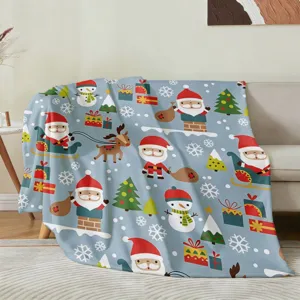 Suave manta de franela navideña con estampados de Papá Noel y renos para decorar el hogar.