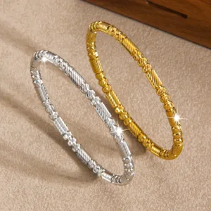 Elegante zweifarbige Titanstahl Perlenarmbänder, stilvolle goldene und silberne Armreifen.