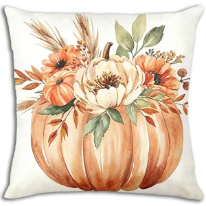 Primo piano dettagliato della stampa con zucca autunnale e fiori ad acquerello sulla federa decorativa.