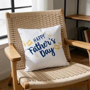 Detailed view of a white Father's Day pillowcase with festive blue text on a cozy wooden chair.
