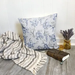 Floral print decorative pillow cover detail, blue and grey botanical cushion case for sofa bed.