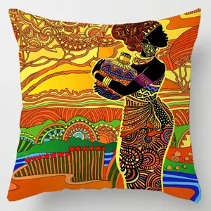 Close-up detail of African tribal art throw pillow cover with vibrant geometric print design.