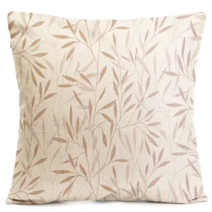Close-up detail of the botanical leaf patterned pillow cover, featuring a soft linen texture.