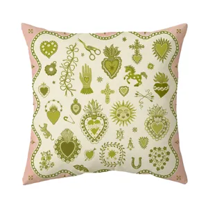 Vintage folk art decorative throw pillow cover with bohemian sacred heart and floral patterns.