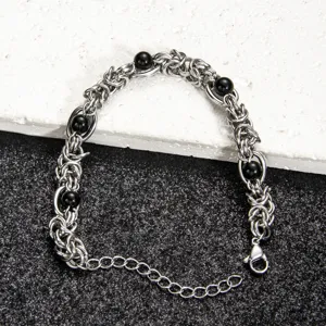 Stainless steel men's chain bracelet with black agate beads punk style detail shot.