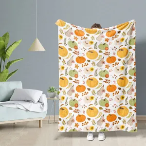 Scène de couverture en flanelle douce avec motif de citrouille d'automne détaillée.