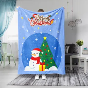 Cozy blue Christmas flannel fleece blanket with cute snowman and tree, perfect for home use.