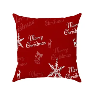 Red Christmas throw pillow cover with festive Merry Christmas print snowflakes and reindeer.