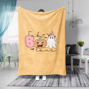 Λεπτομέρεια κουβέρτας φανέλας Halloween με χαριτωμένο φάντασμα και κολοκύθα για καναπέ.