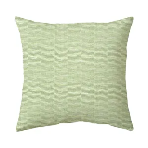 Housse de coussin motif geometrique vert pour canape nordique et details deco.