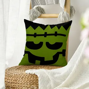 Funda de cojín de lino de Halloween con diseño de cara de monstruo verde para sofá.