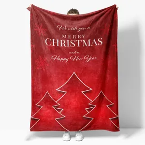 Red Christmas flannel blanket with white festive trees and holiday blessing text for home sofa.