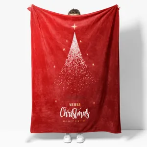 Detailed view of the red flannel Christmas blanket featuring festive tree and text print.