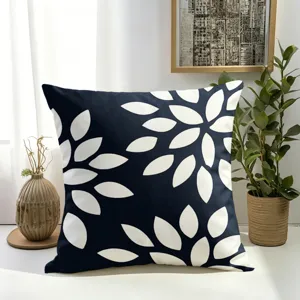 Housse de coussin décorative moderne bleu marine et blanche à motif floral pour canapé lit.