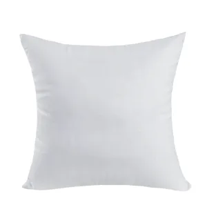 White cushion insert close up detail view, soft plain fabric texture for home decor.