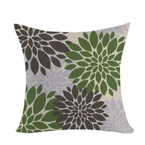 Close-up detail of bohemian style dahlia flower patterned cushion cover, soft fabric texture.