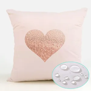 Pink waterproof throw pillow cover detail featuring a sparkling rose gold glitter heart design.
