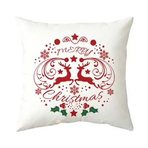 Close-up detail of the festive Christmas deer and snowflake print on the white cushion cover.
