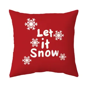 Details view of the red Christmas snowflake throw pillow cover, featuring Let it Snow text.