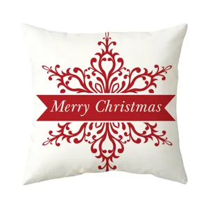 Detailed view of the Christmas snowflake damask pattern and Merry Christmas text on white cushion.
