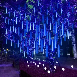 Outdoor waterproof LED meteor shower rain tube string lights hanging on trees at night display