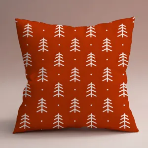 Gros plan du motif minimaliste d'arbre de pin sur la housse de coussin décorative.