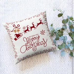 Christmas throw pillow cover detail view featuring red reindeer and Santa Claus print design.