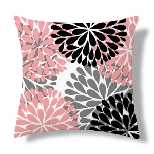 Close-up of the modern floral geometric pattern throw pillow with pink, black, and grey tones.