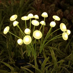 Outdoor solar mushroom garden light glowing in the dark, perfect for landscape yard decoration.