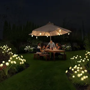 Outdoor solar mushroom garden lights glowing warmly on the lawn for night party scene.