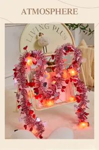 Valentine's Day heart tinsel string lights with glowing LED lights for romantic room decoration.