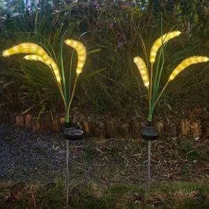 Outdoor solar LED foxtail grass light detail showing glowing night effect in garden landscape.